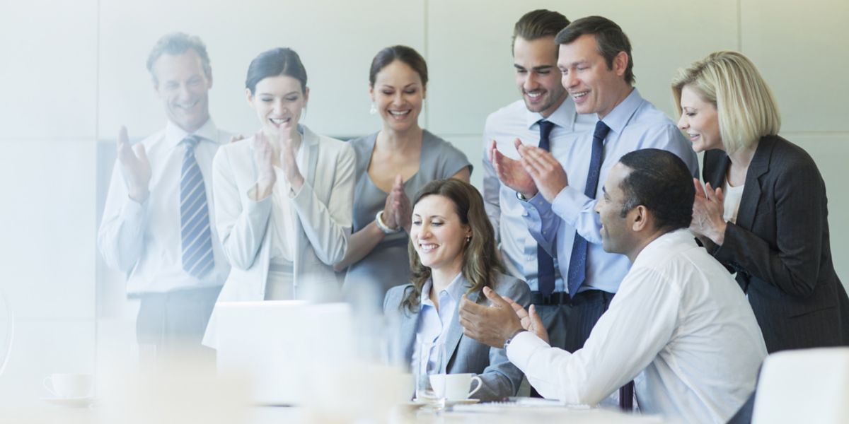 business people cheering in meeting